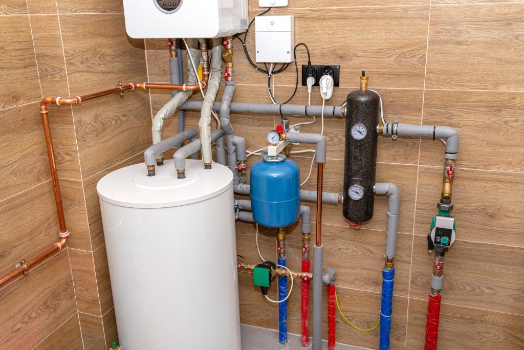 Xceed Plumbing installing water heater tank in Sydney